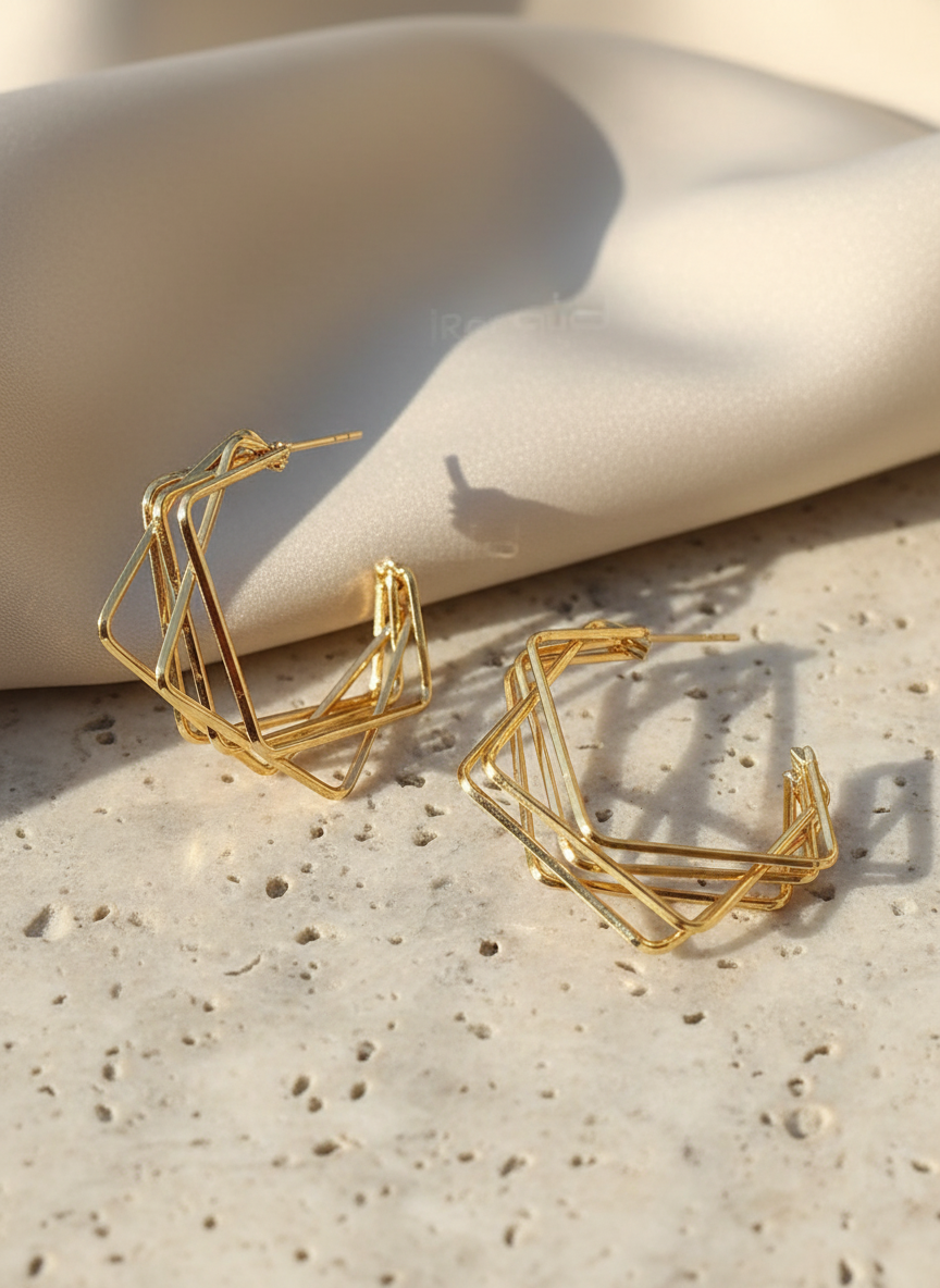 Angular gold-toned hoop earrings by Arayeh