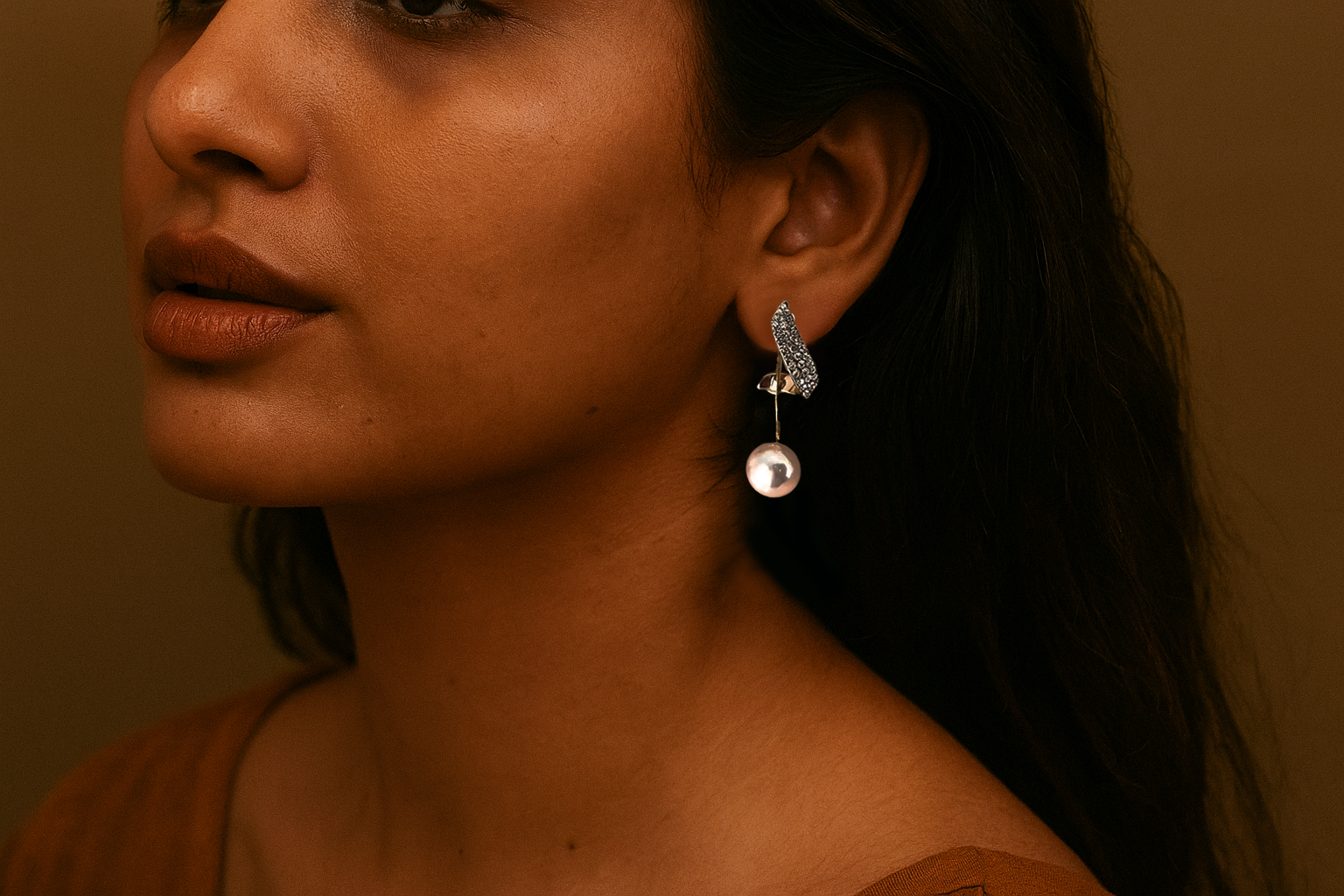 Arayeh pearl earrings styled on a model